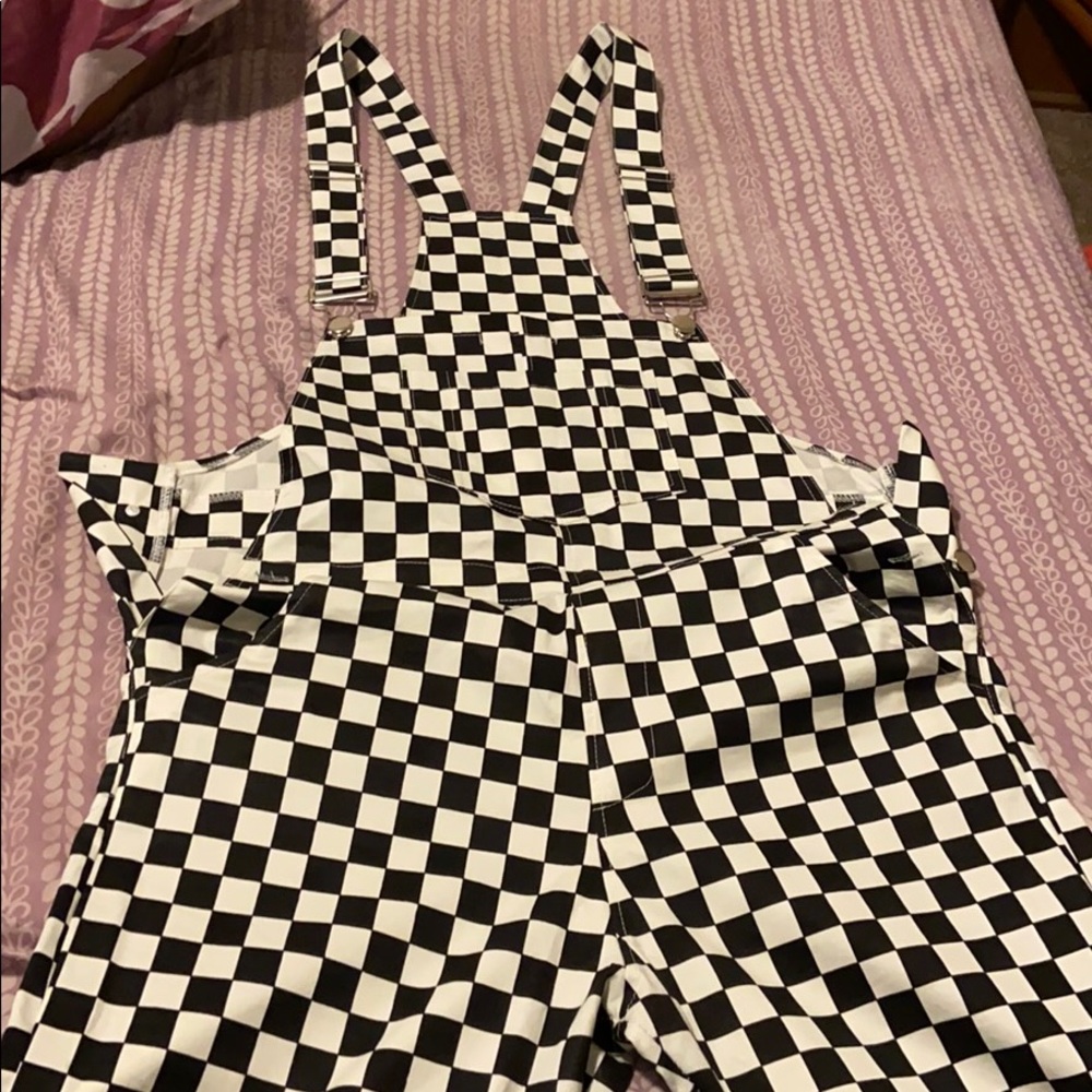 Checkerboard printed overalls.